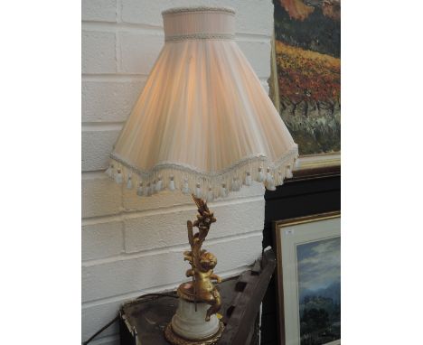 A vintage ormolu style table lamp modelled as cherub and branch