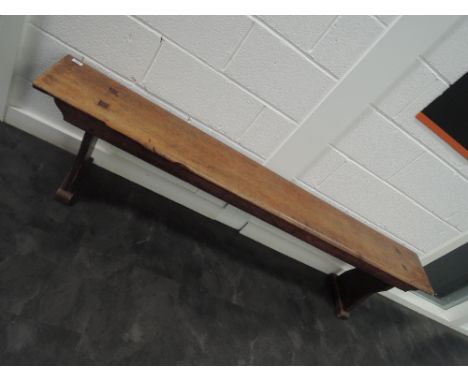 An early 20th century oak bench/form of traditional style