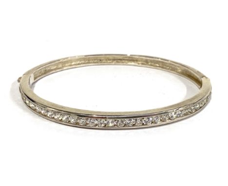 A 925 silver bangle set with cubic zirconia, gross weight 19.9g