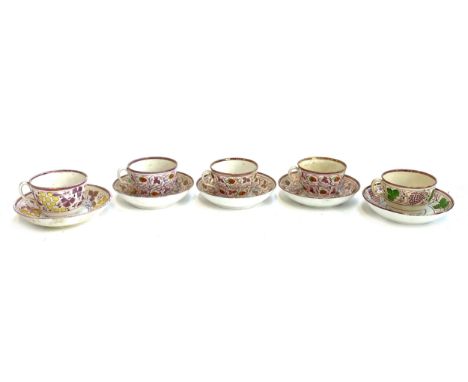 Set of three early nineteenth century lustre ware teacups and saucers decorated with strawberries, and matching side plate, t