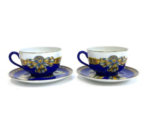 Two Hermes 'Cocarde de Soie' large porcelain teacups and saucers