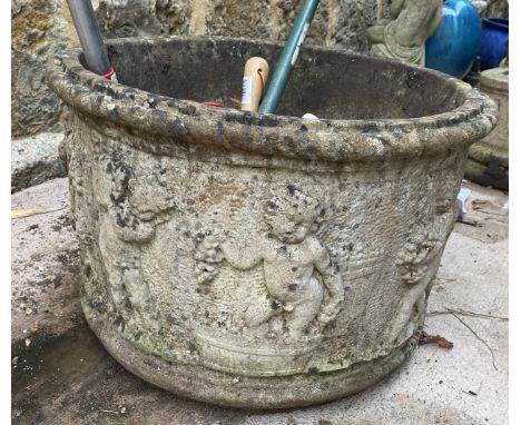 A large composite stone planter and other garden tools, 40cmH by 60cmD together with a bucket of trowels etc