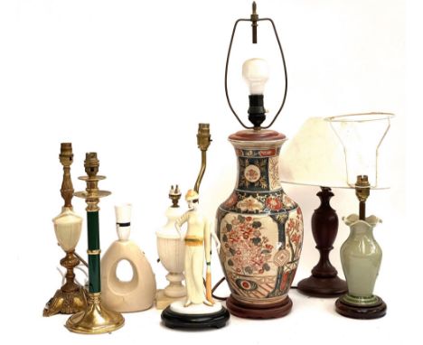 A lot of eight table lamps, to include a figural Art Deco style porcelain and gilt metal lamp, the figure 24cmH (8)