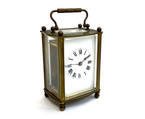 CLOCK: A French made carriage timepiece, in working order, with ball-feet