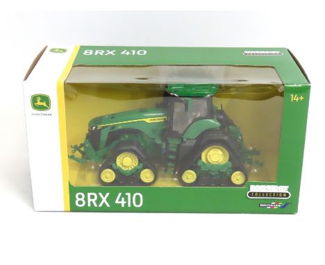 A boxed Britain's 1:32 John Deere 8RX 410 diecast model tractor 