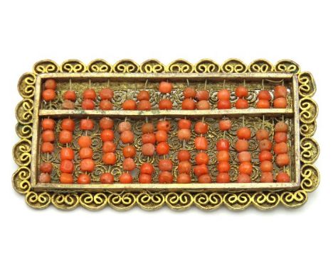 A c.1900 Chinese gilt filigree work coral abacus, 62mm x 32mm, 16.8g