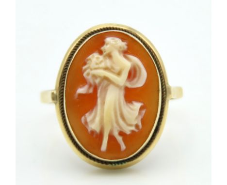 A yellow metal ring set with cameo of woman in flowing dress, tests electronically as 9ct gold, 2.7g, size K/L 