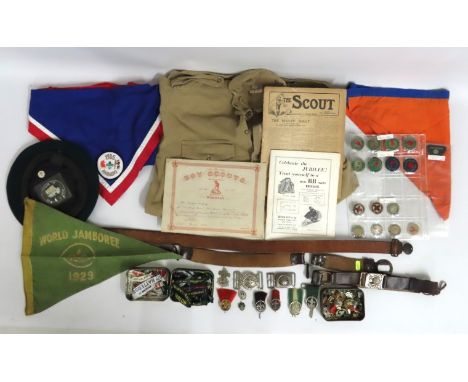 A selection of cub scout related items including 1929 World Jamboree pennant, two silver scout cap badges, early 20thC. leath