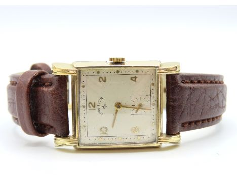 A 1940's Lord Elgin 21 jewel gents wristwatch in 14ct rolled gold case. Case width 26.75mm, winds, runs then stops