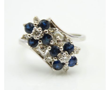 A 14ct white gold ring set with diamond & sapphire, 4.6g, size K/L