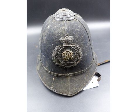 A VICTORIAN BLACK CLOTH DEVON CONSTABLE POLICE HELMET.