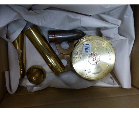 A SMALL GROUP OF VINTAGE SHELL CASES AND PROJECTILES TOGETHER WITH A LARGE FUSE TIMER FROM A HOWITZER TYPE SHELL.   (6)