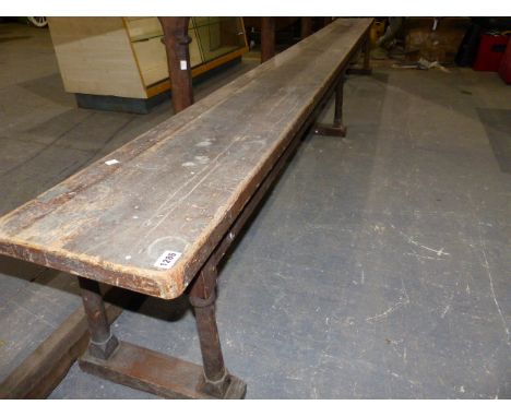 A 19th.C.PINE FORM BENCH ON SIX SPLAY TURNED LEGS.   L.340cms.