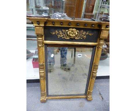 A 19th.C.GILT FRAMED PIER MIRROR WITH PLAIN PLATE FLANKED BY MOULDED PILLARS AND LATER EBONISED FRIEZE PANEL.   72 x 57cms.