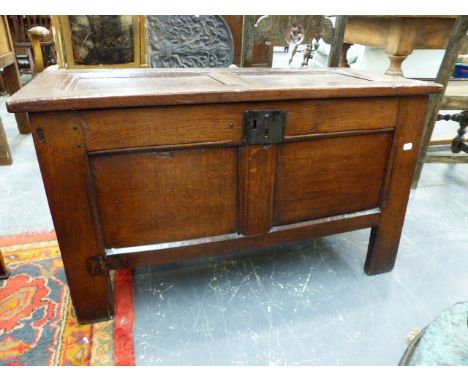 A GEORGIAN COUNTRY OAK COFFER WITH PANEL TOP AND CONFORMING FRONT ON STILE LEGS.   97 x 45 x H.58cms.