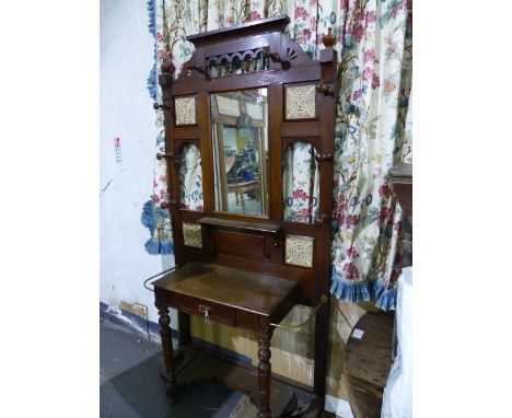 A LATE VICTORIAN OAK HALL STAND WITH INSET CERAMIC TILES AND BRASS STICK SUPPORTS.   W.107 x H.210cms.