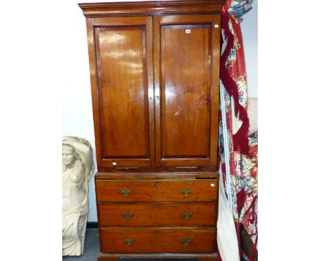 A GEORGIAN OAK CABINET ON CHEST.  TWO DOOR UPPER SECTION WITH SHELVED INTERIOR AND TWO CANDLE SLIDE OVER THREE GRADUATED DRAW