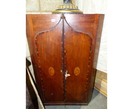 A GEO.III. MAHOGANY WALL HANGING CORNER CABINET WITH TWO SHAPED DOORS FORMING A GOTHIC ARCH, INLAID WITH BOXWOOD MOTIFS.    H