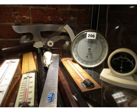 A VINTAGE ANEROID BAROMETER BY T.WHEELER, A BAKELITE CASED ROTOTHERM THERMOMETER, THREE WALL HANGING THERMOMETER, VARIOUS ROL