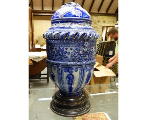 A LARGE GERMAN BLUE POTTERY LAMP BASE ON WOODEN SOCLE.   H.60cms.