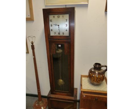 AN ART DECO OAK CASED LONGCASE CLOCK WITH 8-DAY  3 TRAIN MOVEMENT AND 12" SILVERED DIAL.   H.191cms.