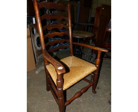 A 19th.C.LANCASHIRE LADDER BACK RUSH SEATED ARMCHAIR.