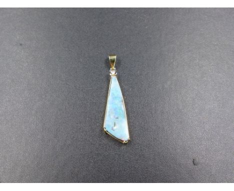 A BOULDER OPAL AND DIAMOND PENDANT, STAMPED 585 TESTED AS 14ct GOLD. APPROXIMATE LENGTH 5.2cms, WEIGHT 6.2grms. 