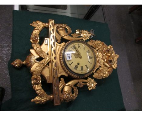 A GILTWOOD CASED WALL CLOCK THE 8-DAY MOVEMENT STRIKING ON A BELL, THE BACK PLATE STAMPED WITH A CROWN OVER AN ESCAPEMENT WHE
