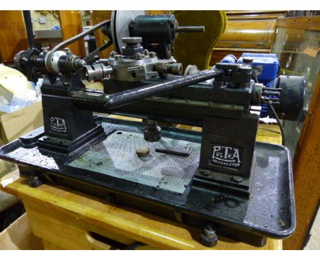 A PULTRA MODEL OR WATCHMAKER'S LATHE WITH CAPSTAN TOOL HEAD AND VARIOUS ATTACHMENTS,