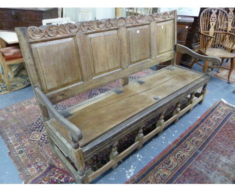 AN EARLY 18th.C.AND LATER OAK PANEL BACK HALL SETTLE WITH SHALLOW BOX SEAT.   W.184 x D.61 x H.105cms.