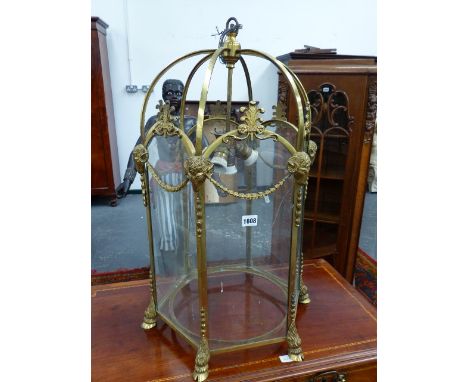 A REGENCY STYLE BRASS OCTAGONAL HALL LANTERN WITH RAMS MASK DECORATION.   H.74cms.