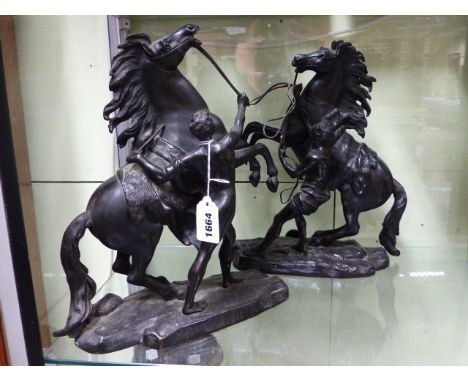 A PAIR OF LATE 19th./EARLY 20th.C. BRONZE MARLEY HORSE FIGURES OF REARING STALLIONS ON PLINTH BASES.   H.34cms.