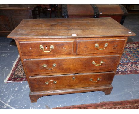 AN 18th.C.OAK SMALL CHEST OF TWO SHORT AND TWO LONG GRADUATED DRAWERS ON BRACKET FEET.   92 x 45 x H.75cms.