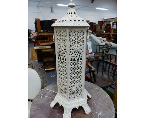 A VINTAGE WHITE PAINTED CAST IRON GOTHIC REVIVAL STYLE CONSERVATORY HEATER NOW MOUNTED AS A LAMP WITH COLOURED GLASS INSERTS.