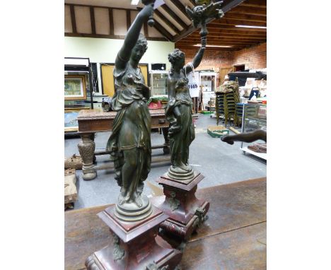 A PAIR OF LATE 19th.C.FRENCH BRONZE AND MARBLE CANDLESTICKS/ LAMPS IN THE FORM OF CLASSICAL MAIDENS.   H.68cms.