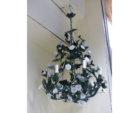 A TOLEWARE CAGE FORM ROCOCO STYLE SIX LIGHT CHANDELIER WITH LEAF MOTIFS AND CERAMIC FLOWERHEADS.   H.65cms.