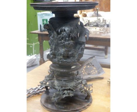 A JAPANESE BRONZE VASE, THE BROAD RIM WITH THUNDER SCROLL ENCLOSING FLORAL BANDS ABOVE A CYLINDRICAL BODY CAST IN HIGH RELIEF