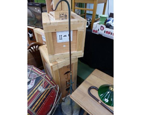 A PAIR OF WROUGHT IRON GARDEN HANGING BASKET/LANTERN SUPPORTS ON WEIGHTED BASES. (2)
