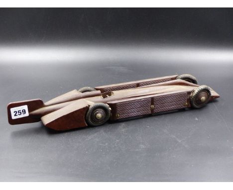 A BAKELITE CLOCKWORK MODEL OF THE GOLDEN ARROW WITH RUBBER TYRES. STAMPED A G LTD. PATENT No. 309369.    L.43cms.