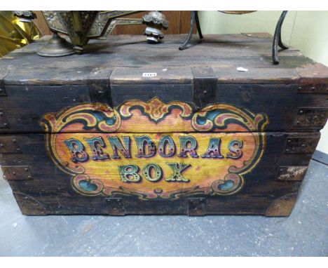 AN IRON BOUND PINE TRUNK WITH APPLIED DECORATION PANEL BENDORAS BOX FORMERLY CONTAINING A VENTRILOQUIST DUMMY.   86 x 50 x 47
