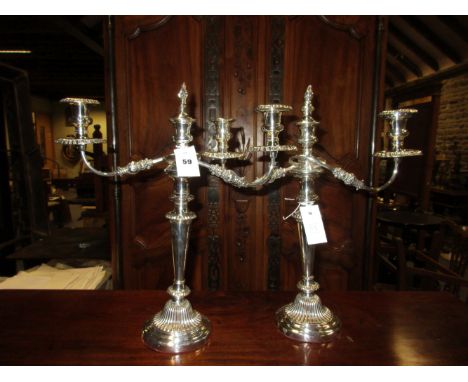A PAIR OF OLD SHEFFIELD PLATE THREE LIGHT CANDELABRA, THE CENTRAL LIGHT TO EACH REMOVABLE BRANCH WITH FLAMBEAU FINISH, GADROO