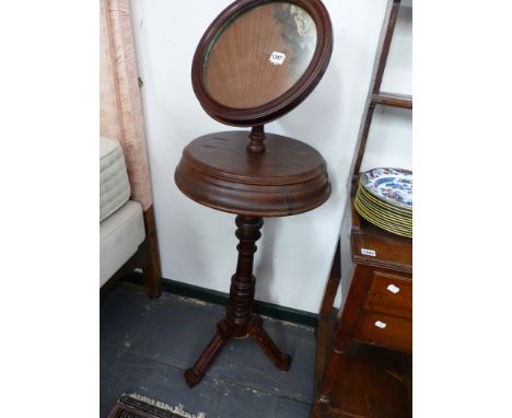 A VICTORIAN HEIGHT ADJUSTABLE SHAVING MIRROR WITH PLATFORM COMPARTMENTS ON SHAPED TRIPOD LEGS TOGETHER WITH A VICTORIAN OAK F