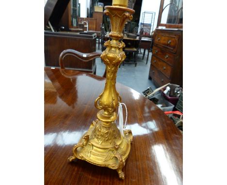 A GILT METAL TABLE LAMP BASE WITH WINGED GRIFFIN DECORATION ON PAW FEET.   OVERALL H.41cms.