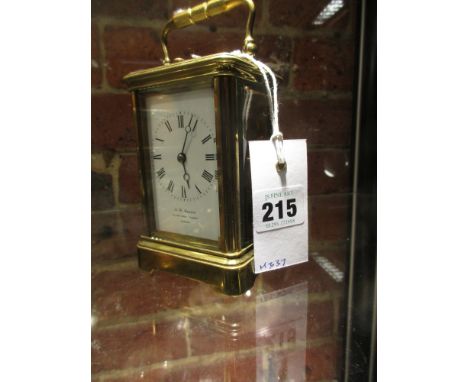 A FRENCH CARRIAGE CLOCK RETAILED BY J.W. BENSON, THE STRIKE/REPEAT ON A COILED ROD.    H. 11.5cms.