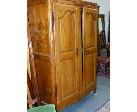 A FRENCH PROVINCIAL CARVED AND INLAID WALNUT AND FRUITWOOD ARMOIRE WITH TWIN PANEL DOORS.    H.192 x W.120cms.