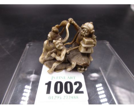 A JAPANESE CARVED IVORY NETSUKE OF VARIOUS DEMONS AND MYTHICAL FIGURES.   H.4cms.