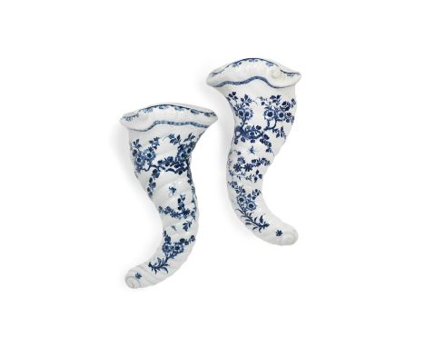 A pair of Worcester cornucopiae, circa 1757-60Of large size, modelled as spiralling horns with rococo shell rims, painted in 