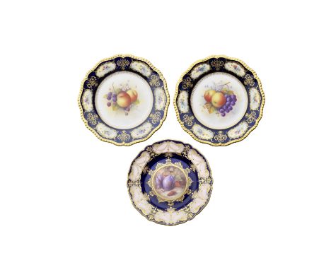 Three Royal Worcester 'Painted Fruit' plates, dated 1936 and 1917Comprising a pair of plates with sprays of fruit by Albert S