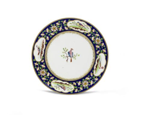A good Nantgarw plate, circa 1818-20Of Cardiff Castle Service type, painted in London in Canton enamel style, the border with
