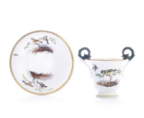 A fine Nantgarw cabinet cup and stand, circa 1818-20The cup of U-shape, the twin griffin handles resting on the everted rim p
